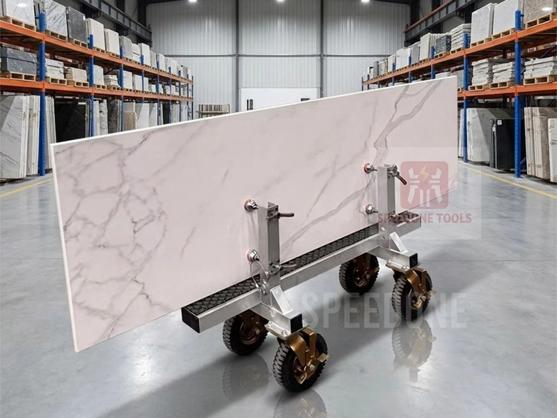 Slab transport cart for moving stone through a factory